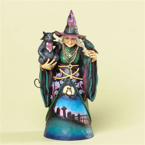 Spice Up Your Halloween Décor with Witch Figurines That Glow and Enchant